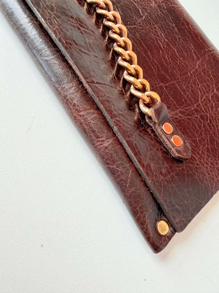 Moss Mills Dark Brown Textured Leather Clutch With Gold Chain Detail