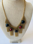 Gold Tone Tassel Necklace With Burgundy and Black Stones