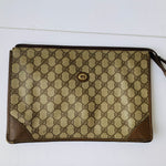 Authentic 1980’s Gucci Coated Canvas Clutch/Accessory Pouch in Brown