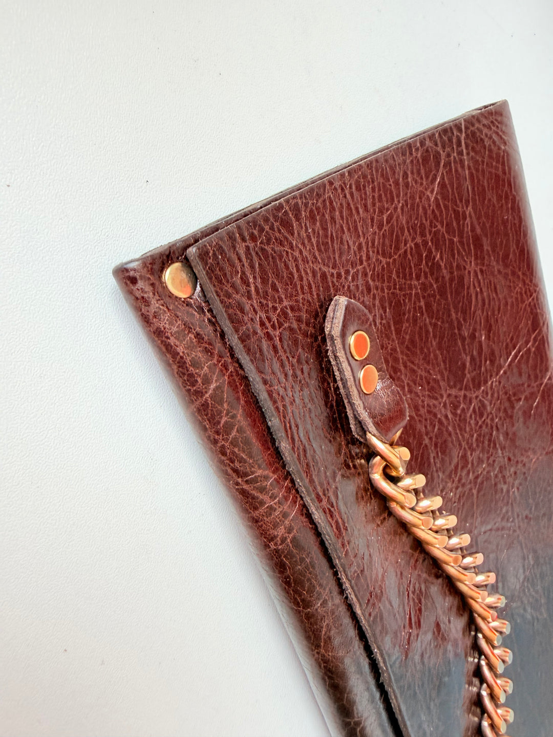 Moss Mills Dark Brown Textured Leather Clutch With Gold Chain Detail