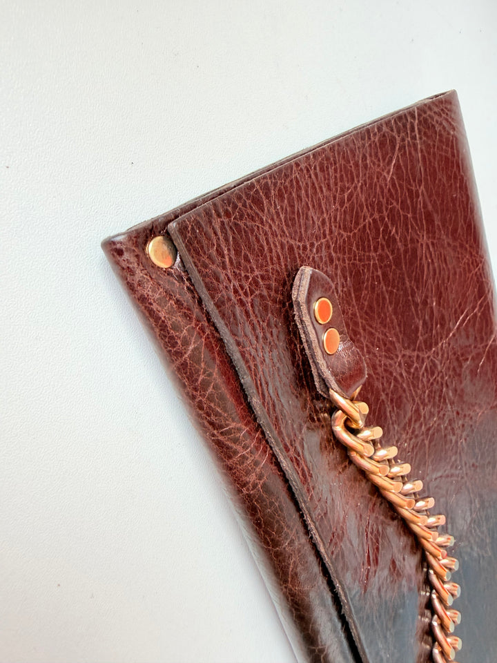 Moss Mills Dark Brown Textured Leather Clutch With Gold Chain Detail