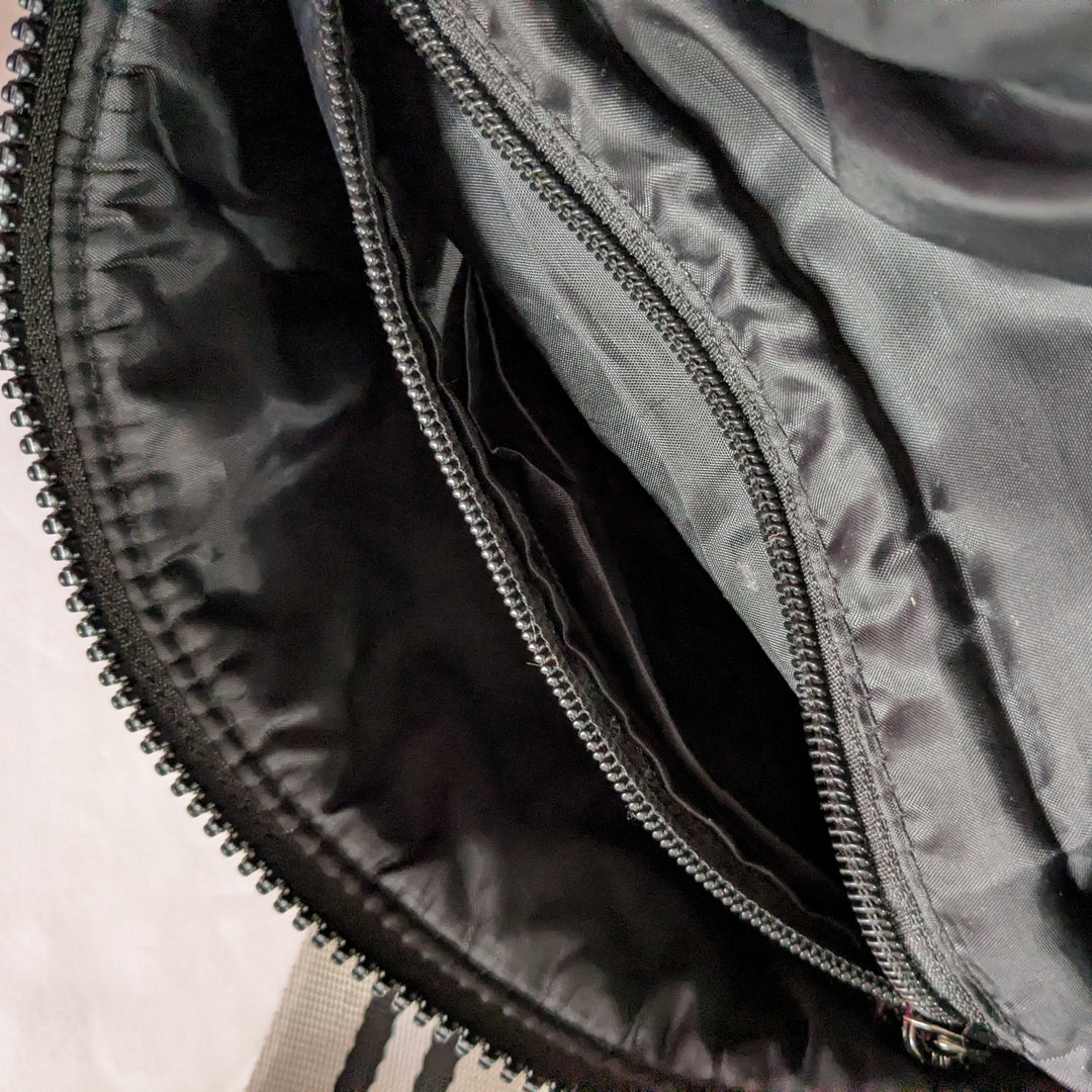 Think Rolyn Little Runaway Silver Belt Bag